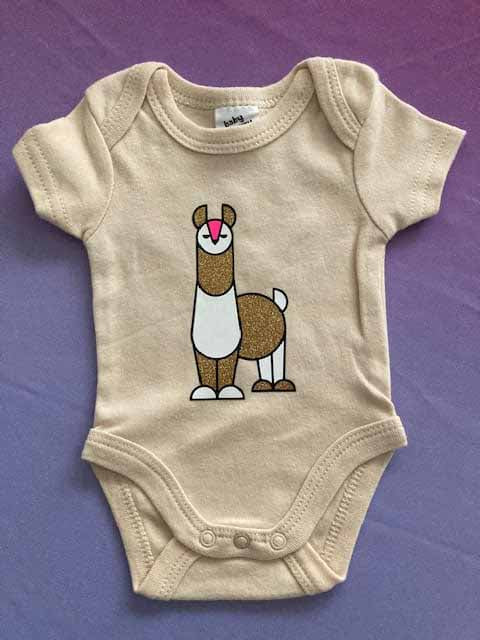 Soft cotton baby bodysuit with custom printed llama design, perfect first birthday gift